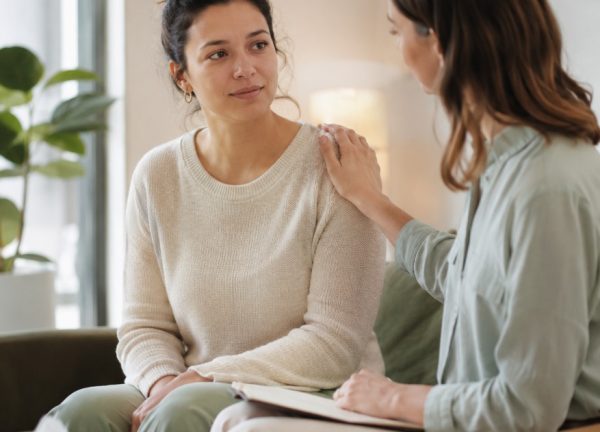 counsellor comforting woman